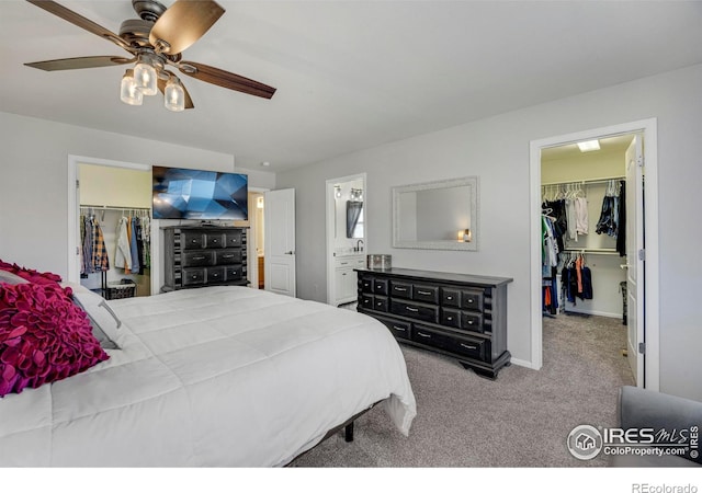 5822 Shenandoah Ave, Firestone, CO 80504 - bedroom featuring a walk in closet, a closet, and carpet floors