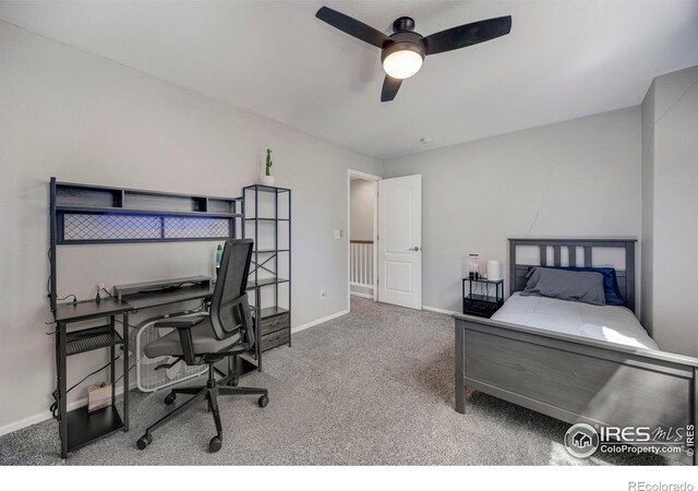5822 Shenandoah Ave, Firestone, CO 80504 - carpeted bedroom with baseboards, a desk, and a ceiling fan