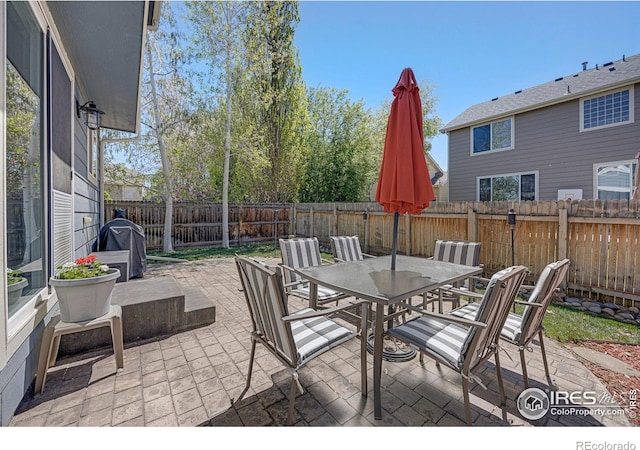 5822 Shenandoah Ave, Firestone, CO 80504 - fenced backyard with outdoor dining area and a patio