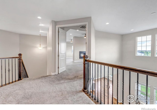 913 Green Mountain Dr, Erie, CO 80516 - hallway with an upstairs landing, carpet flooring, recessed lighting, and baseboards