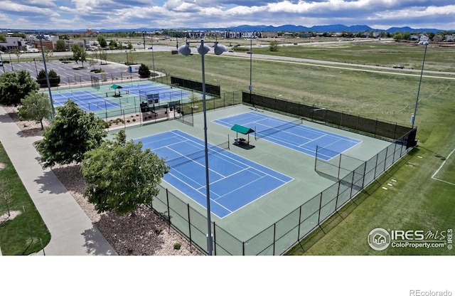 913 Green Mountain Dr, Erie, CO 80516 - view of tennis court with a mountain view