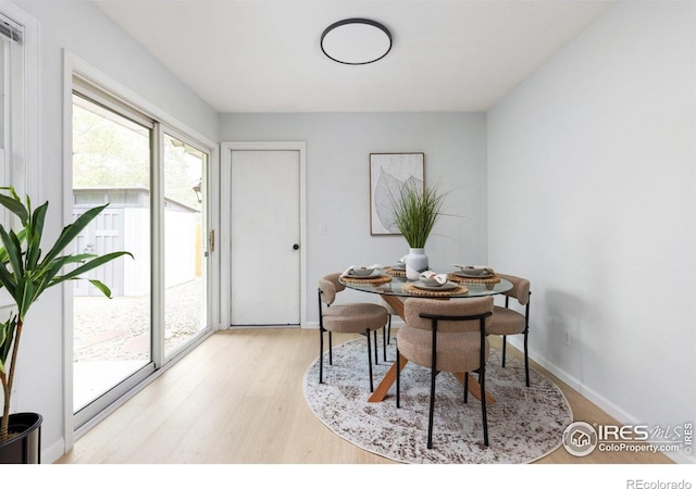 13441 Sheridan Blvd, Broomfield, CO 80020 - dining area with light wood-style floors and baseboards