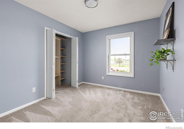 13441 Sheridan Blvd, Broomfield, CO 80020 - unfurnished bedroom featuring carpet floors, baseboards, and a textured ceiling