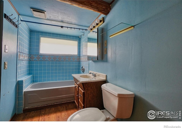 545 Eldorado Ave, Nederland, CO 80466 - bathroom with wood finished floors, toilet, vanity, and a bathtub