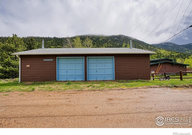 545 Eldorado Ave, Nederland, CO 80466 - detached garage featuring a mountain view