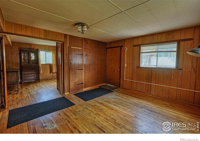 545 Eldorado Ave, Nederland, CO 80466 - foyer entrance with hardwood / wood-style floors, plenty of natural light, and wooden walls