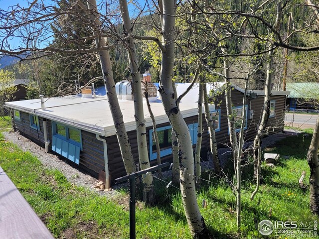 545 Eldorado Ave, Nederland, CO 80466 - view of side of home with a chimney