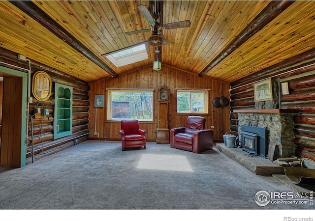 545 Eldorado Ave, Nederland, CO 80466 - sitting room with wood ceiling, a ceiling fan, a skylight, carpet flooring, and log walls