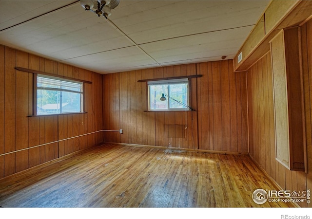 545 Eldorado Ave, Nederland, CO 80466 - spare room with light wood finished floors and wooden walls