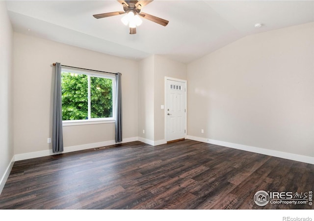 1512 Snowy Range Ct, Loveland, CO 80538 - spare room with dark wood-type flooring, ceiling fan, vaulted ceiling, and baseboards