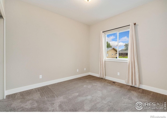 1512 Snowy Range Ct, Loveland, CO 80538 - carpeted spare room featuring baseboards