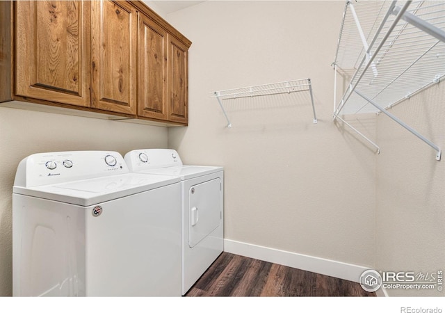 1512 Snowy Range Ct, Loveland, CO 80538 - laundry area with washer and dryer, cabinet space, dark wood-type flooring, and baseboards