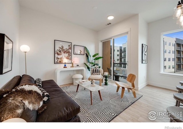 2876 W 53rd Ave Unit 301, Denver, CO 80221 - living room with light wood-style floors and baseboards