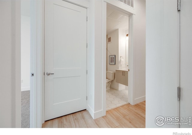 2876 W 53rd Ave Unit 301, Denver, CO 80221 - corridor with wood finished floors and baseboards
