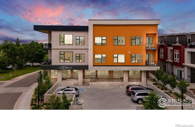 2876 W 53rd Ave Unit 301, Denver, CO 80221 - property at dusk with uncovered parking