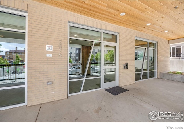 2876 W 53rd Ave Unit 301, Denver, CO 80221 - entrance to property featuring brick siding and a patio