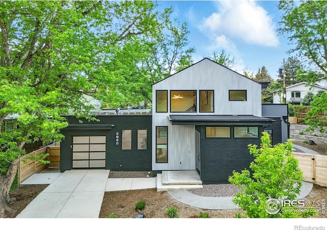 2860 Table Mesa Dr, Boulder, CO 80305 - contemporary home featuring driveway and brick siding