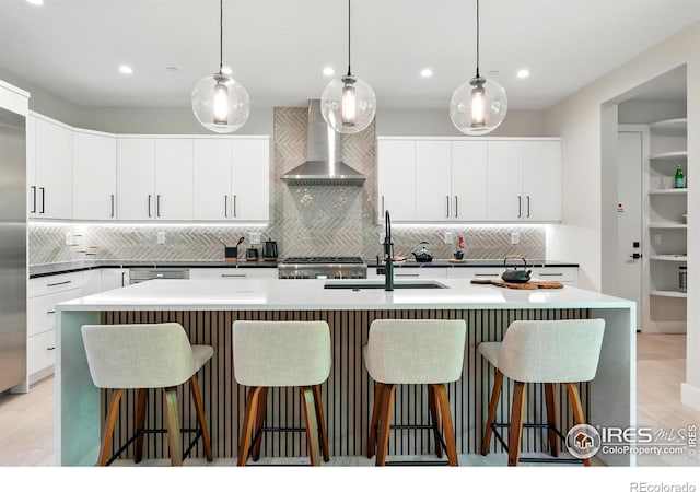 2860 Table Mesa Dr, Boulder, CO 80305 - kitchen with wall chimney range hood, a sink, decorative backsplash, modern cabinets, and recessed lighting