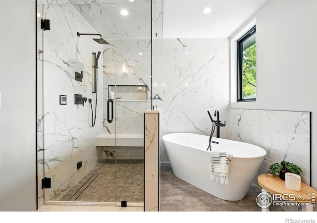 2860 Table Mesa Dr, Boulder, CO 80305 - full bath with tile walls, a freestanding tub, a marble finish shower, and recessed lighting