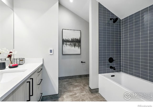 2860 Table Mesa Dr, Boulder, CO 80305 - bathroom with vanity, lofted ceiling, bathing tub / shower combination, and baseboards