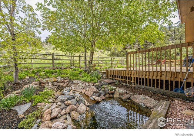 17284 W County Road 74e, Red Feather Lakes, CO 80545 - view of yard featuring a wooden deck