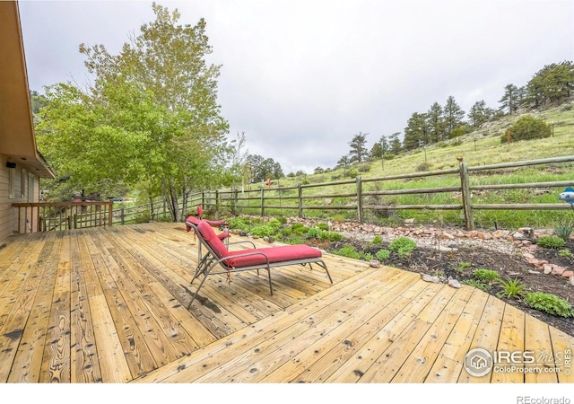 17284 W County Road 74e, Red Feather Lakes, CO 80545 - wooden deck with a view of countryside