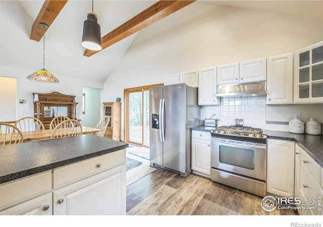 17284 W County Road 74e, Red Feather Lakes, CO 80545 - kitchen featuring appliances with stainless steel finishes, under cabinet range hood, high vaulted ceiling, dark countertops, and beamed ceiling