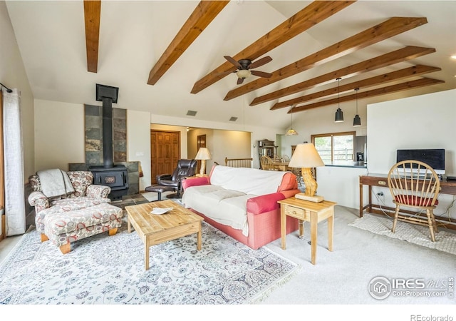 17284 W County Road 74e, Red Feather Lakes, CO 80545 - carpeted living area featuring a wood stove and a ceiling fan