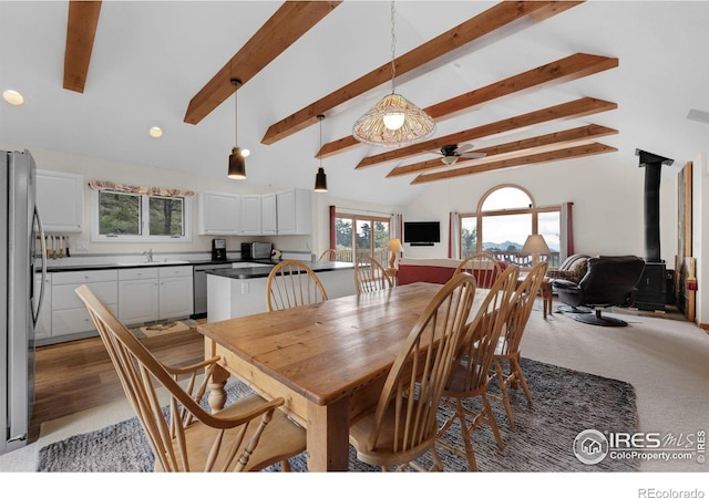 17284 W County Road 74e, Red Feather Lakes, CO 80545 - dining space with a wood stove, a ceiling fan, recessed lighting, and light colored carpet