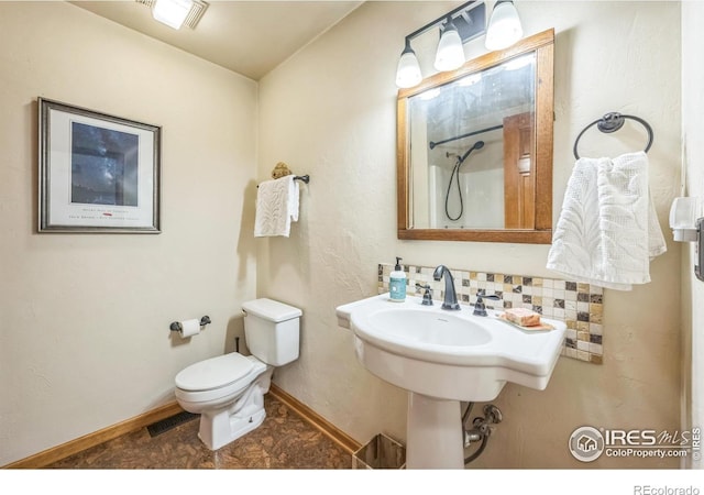 17284 W County Road 74e, Red Feather Lakes, CO 80545 - full bathroom featuring toilet, a shower, and baseboards