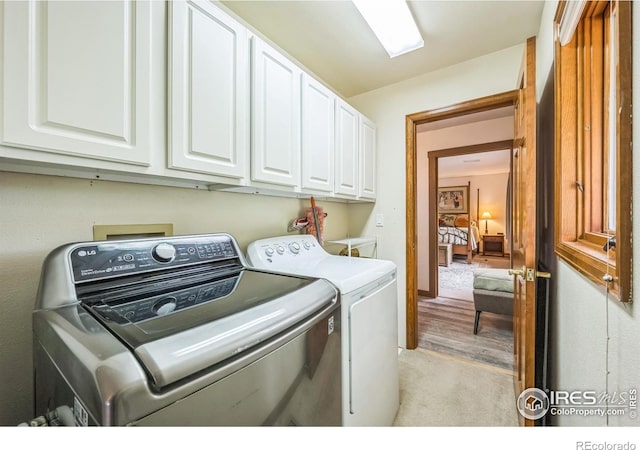 17284 W County Road 74e, Red Feather Lakes, CO 80545 - washroom with washer and clothes dryer and cabinet space