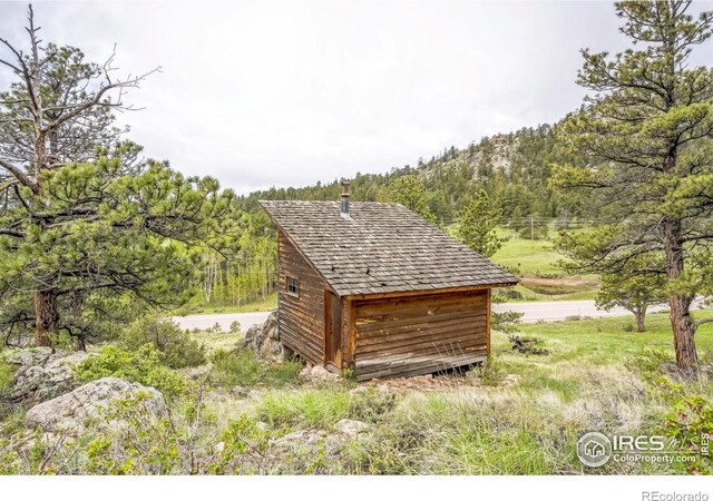 17284 W County Road 74e, Red Feather Lakes, CO 80545 - view of shed with a mountain view and a forest view