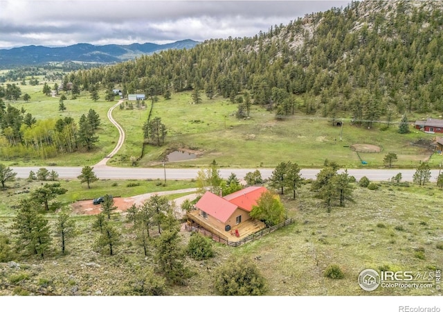 17284 W County Road 74e, Red Feather Lakes, CO 80545 - view of subject property with a mountainous background and a heavily wooded area