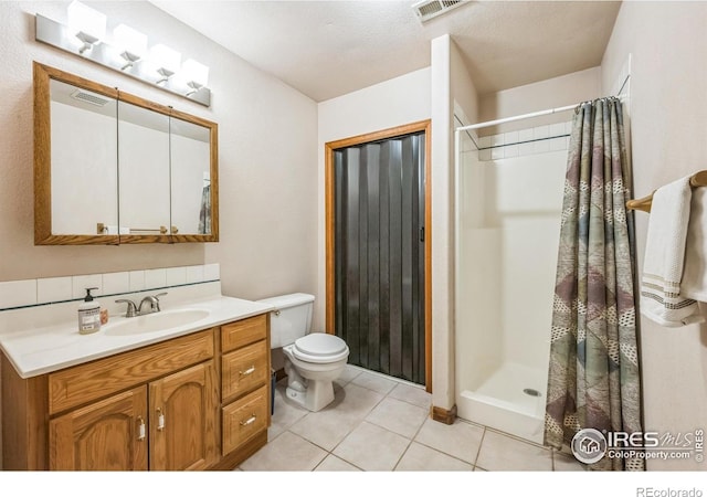 17284 W County Road 74e, Red Feather Lakes, CO 80545 - full bath featuring toilet, vanity, tile patterned flooring, and curtained shower