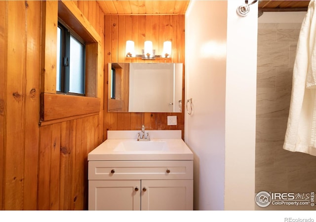 35106 Boulder Canyon Dr, Boulder, CO 80302 - bathroom featuring wood walls, vanity, and wooden ceiling