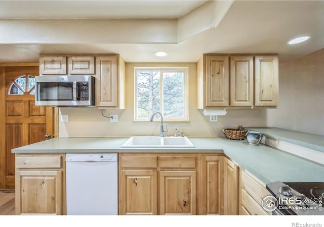 24192 W County Road 74e, Red Feather Lakes, CO 80545 - kitchen with dishwasher, stainless steel microwave, a sink, light brown cabinets, and recessed lighting