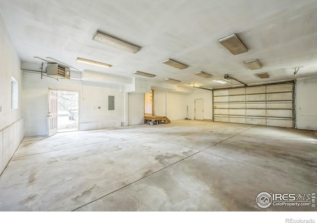 24192 W County Road 74e, Red Feather Lakes, CO 80545 - garage featuring electric panel and a heating unit