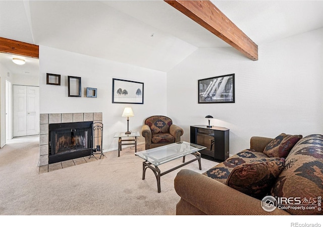 5520 Stonewall Pl Unit 31, Boulder, CO 80303 - living room featuring carpet flooring, a tile fireplace, and baseboards