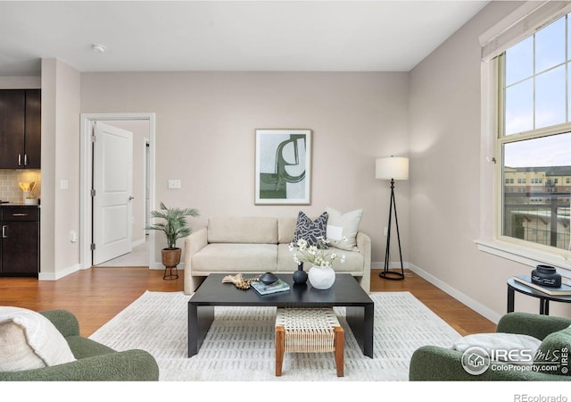 13598 Via Varra Unit 404, Broomfield, CO 80020 - living area with wood finished floors and baseboards