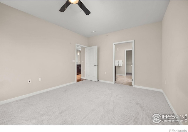 13598 Via Varra Unit 404, Broomfield, CO 80020 - unfurnished bedroom with carpet, baseboards, a ceiling fan, and connected bathroom