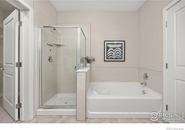 13598 Via Varra Unit 404, Broomfield, CO 80020 - full bathroom featuring a garden tub and a shower stall
