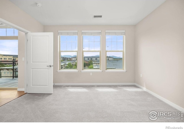 13598 Via Varra Unit 404, Broomfield, CO 80020 - carpeted empty room featuring baseboards and healthy amount of natural light