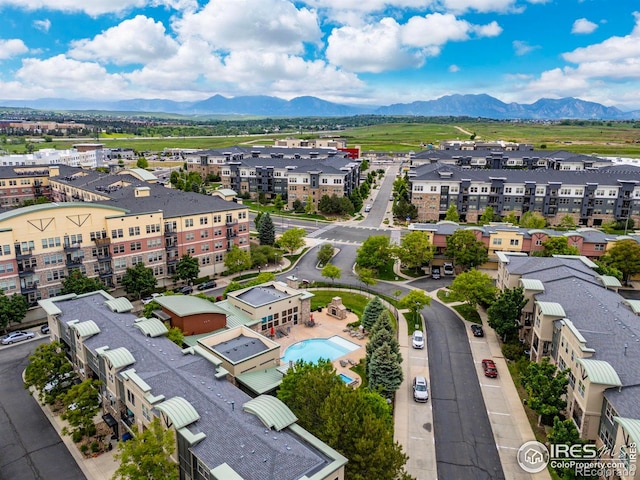 13598 Via Varra Unit 404, Broomfield, CO 80020 - drone / aerial view of a mountainous background and a pool area