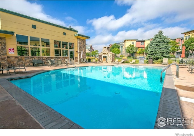 13598 Via Varra Unit 404, Broomfield, CO 80020 - community pool featuring a patio area