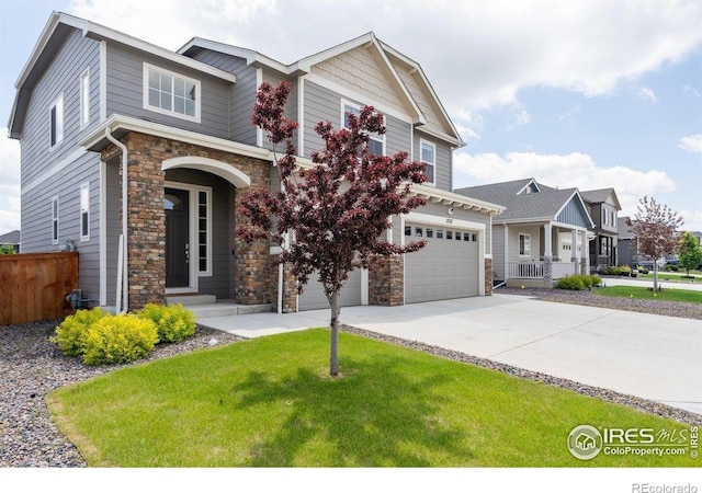 1257 Wild Basin Rd, Severance, CO 80550 - craftsman-style house with stone siding, an attached garage, and driveway