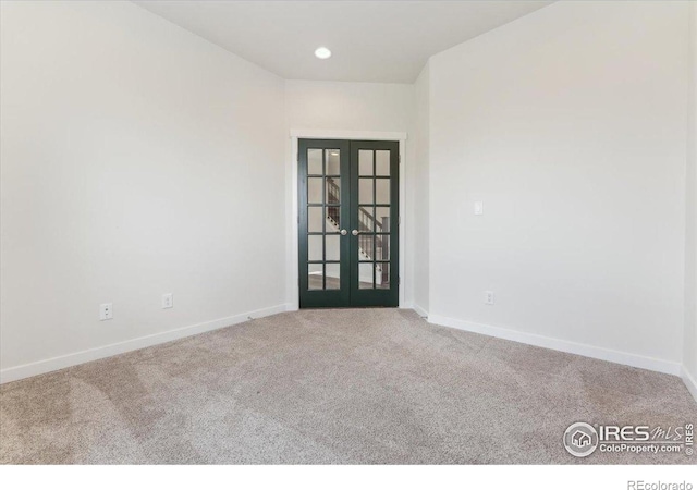 1257 Wild Basin Rd, Severance, CO 80550 - empty room featuring french doors, carpet floors, and baseboards