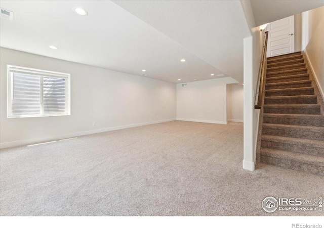 1257 Wild Basin Rd, Severance, CO 80550 - basement featuring carpet floors, stairs, recessed lighting, and baseboards