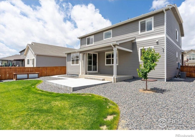 1257 Wild Basin Rd, Severance, CO 80550 - back of house with a patio and central AC