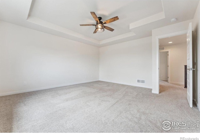 1257 Wild Basin Rd, Severance, CO 80550 - unfurnished room with a raised ceiling, a ceiling fan, carpet, and baseboards