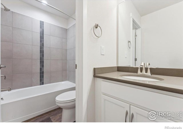 1257 Wild Basin Rd, Severance, CO 80550 - bathroom featuring toilet, vanity, wood finished floors, and shower / bath combination